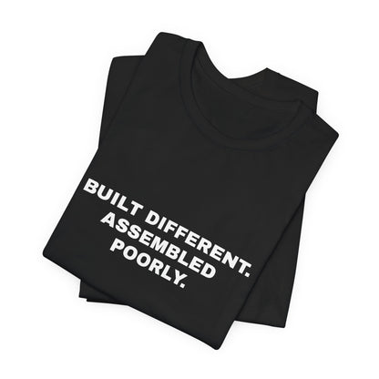 Built Different, Assembled Poorly — Unisex Graphic Tee